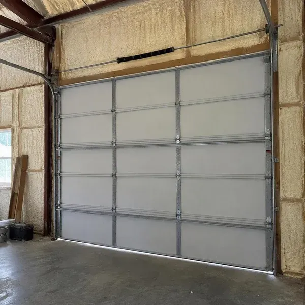 Spray foam insulated garage walls around the overhead door framing